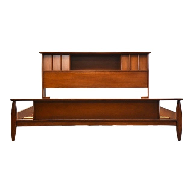 Mid Century Walnut Full Bed: Mid Century Walnut Full Bed A mid century modern full size walnut bed with a sliding bookcase headboard. Footboard is 14" tall. Clearance under the side rails is 4.5". 61.75" wide. 87" deep. 35.75" ta