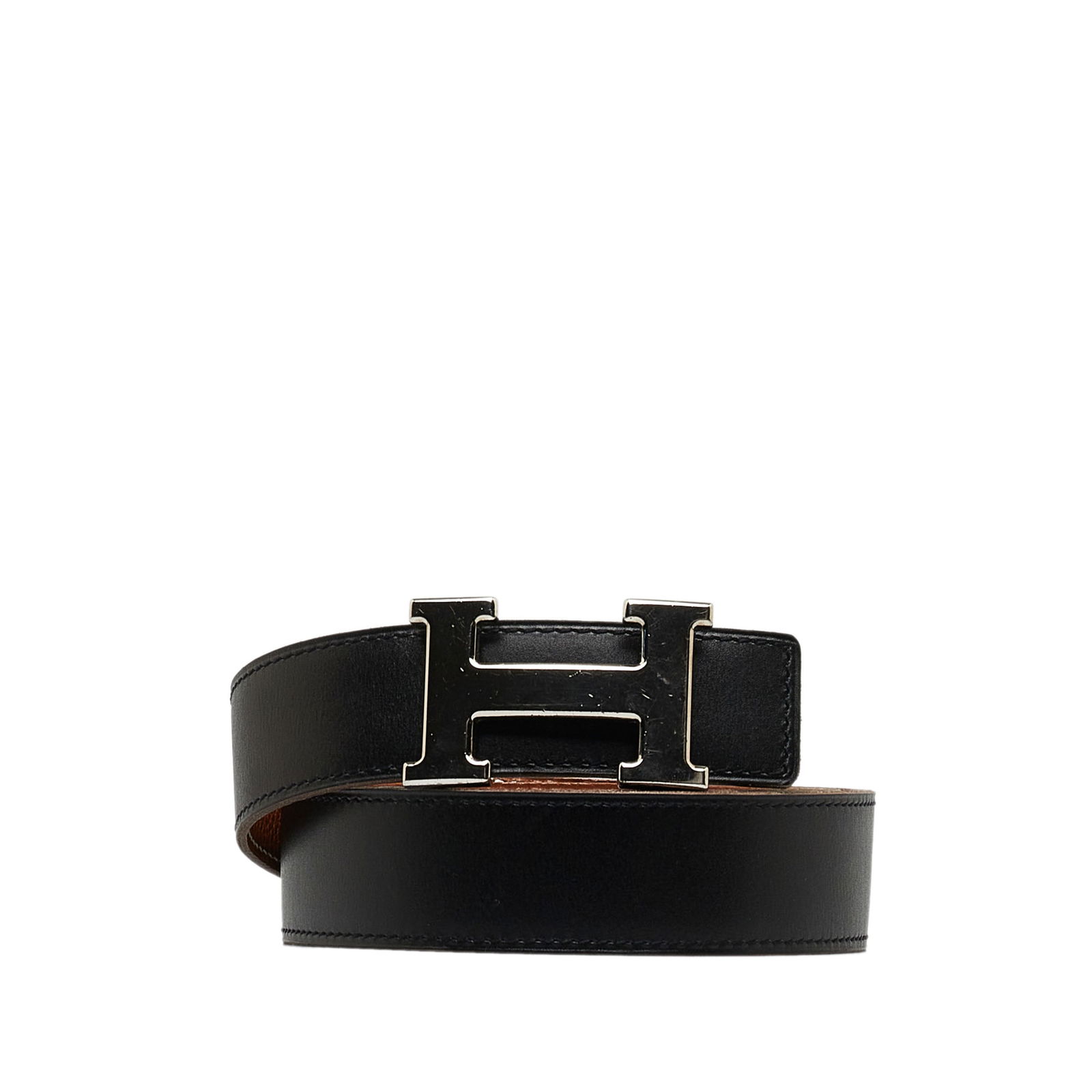 Hermes Constance Reversible Belt: Hermes Constance Reversible Belt This belt features a leather body and a metal buckle. Brand: Hermes Model: Constance Reversible Belt Origin: France Category: Accessories Color: Black Style: Material: