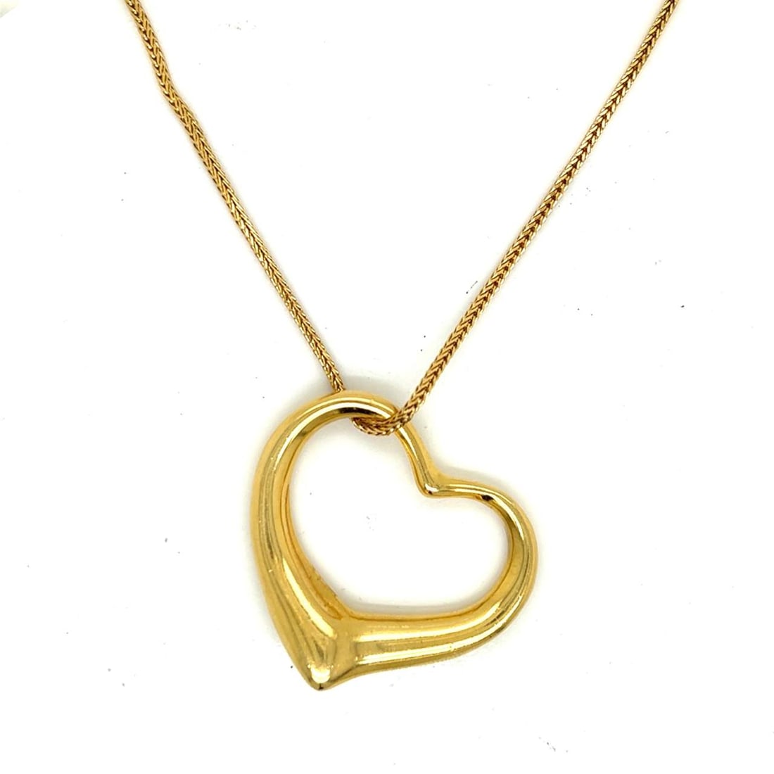 Tiffany & Co Necklace: Tiffany & Co Necklace Tiffany & Co. Elsa Perretti 18K Yellow Gold Heart Necklace Weighing 22.6 grams Signed 32 inches length Appraisal Price: $6,100 The BIDHAUS Guarantee: All items in this auction ar