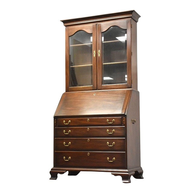 Henkel Harris Mahogany Secretary Desk: Henkel Harris Mahogany Secretary Desk A solid mahogany secretary desk with a drop slant front and a hidden compartment made by Henkel Harris. Brass bail pulls. 40.5" wide. 21.25" deep. 81.25" tall. Di