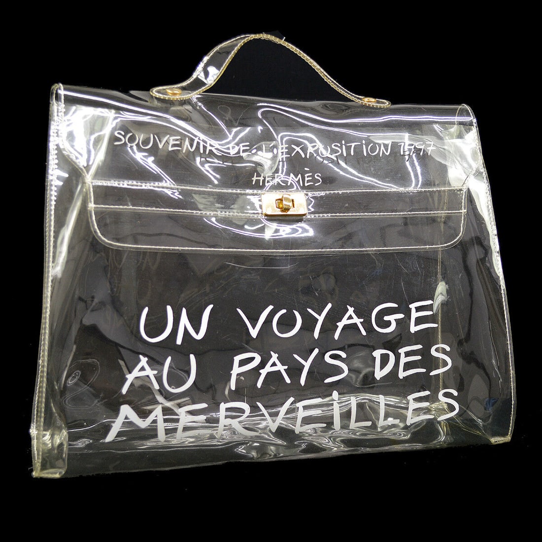 HERMES Vinyl Kelly Hand Beach Bag SOUVENIR DE LEXPOSITION 1997: HERMES Vinyl Kelly Hand Beach Bag SOUVENIR DE LEXPOSITION 1997 Exterior Material: Vinyl Style: Hand Bag Exterior Color: Clear Size: Medium Closure: Flap Turnlock Bag Depth: 4.5 Bag Width: 15.7 Bag Hei