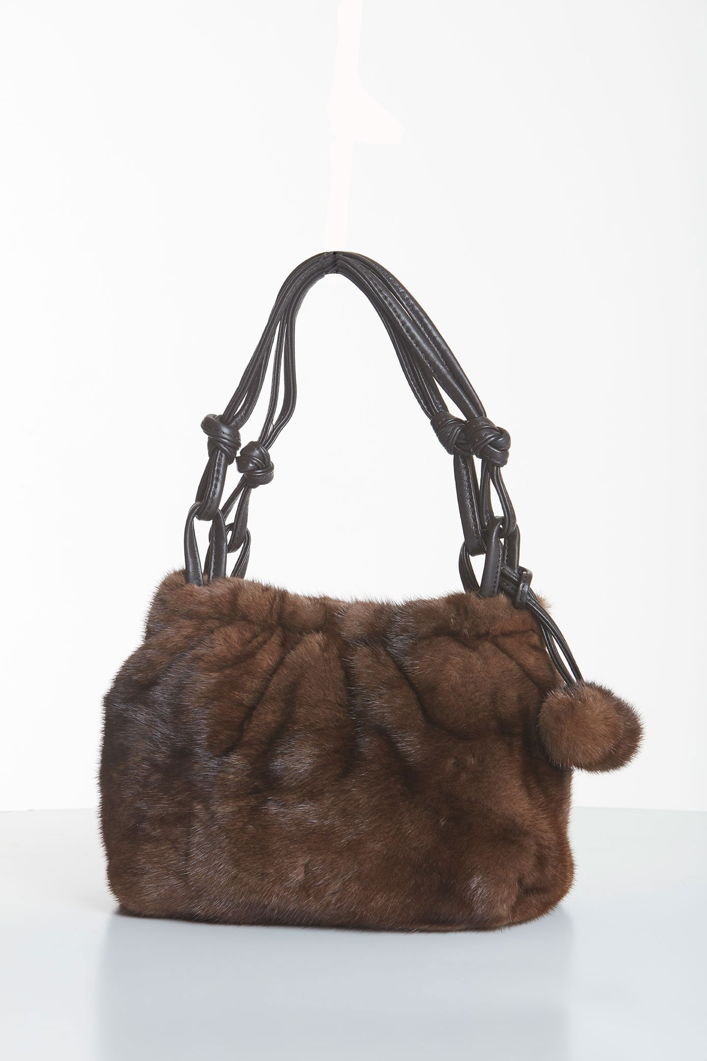 Mink Fur Handbag - Midsize - Soft Brown Mink Pom Poms: Mink Fur Handbag - Midsize - Soft Brown Mink Pom Poms You've finally found a bag that can carry you from day into night. Start your day with a boost - with this lovely mink bag you have room for all y