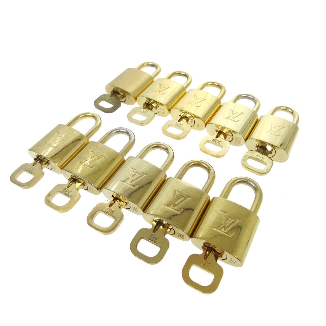 LOUIS VUITTON Padlock & Key Bag Accessories Charm 10 Piece Set Gold: LOUIS VUITTON Padlock & Key Bag Accessories Charm 10 Piece Set Gold Type: Padlock Color: Gold Outside Condition: B: Reasonable Wear and Tear/Inside Condition: C: Heavily Used The BIDHAUS Guarantee: Al