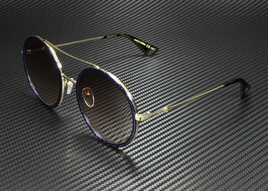 GUCCI GG0061S 005 Round Oval Gold Brown Womens Sunglasses 56 mm: GUCCI GG0061S 005 Round Oval Gold Brown Womens Sunglasses 56 mm Type: Sunglasses Frame Color: Gold Style: Round Lens Color: Brown Features: Lightweight Lens Technology: Gradient Frame Material: Acetat