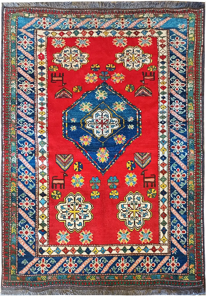 5 x 7 Pre Owned Kord Kazak Rug: 5 x 7 Pre Owned Kord Kazak Rug Free continental US Shipping Size in Feet: Width: 4.11 x Length: 6.7 Size in Inches: Width: 59 in x Length: 79 in Rug Type: Area Rug Colors: Coral red Blue Ivory Weave: 