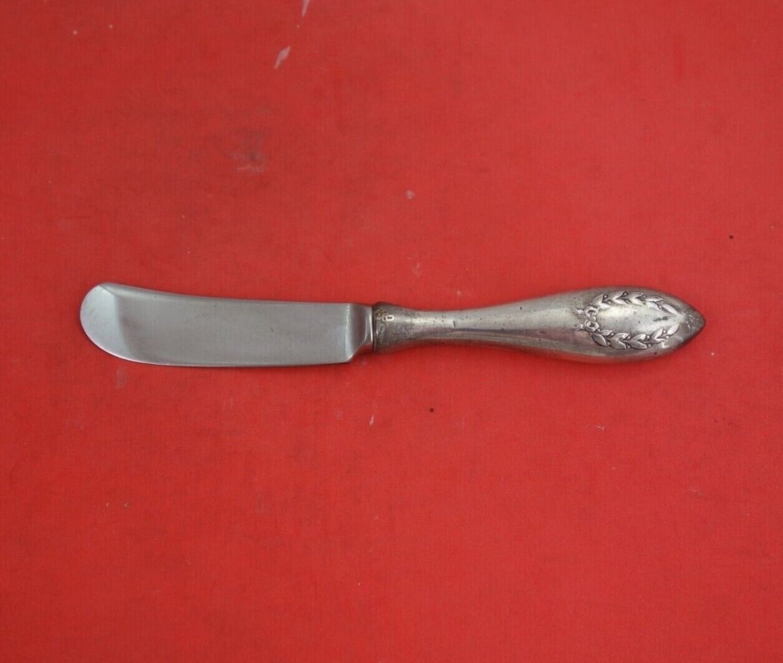 Laurel by Frank Smith Sterling Silver Butter Spreader Hollow Handle 5 3/4": Laurel by Frank Smith Sterling Silver Butter Spreader Hollow Handle 5 3/4" Laurel by frank smithsterling silver hollow handle with stainless blade butter spreader 5 3/4" in the pattern laurel by frank