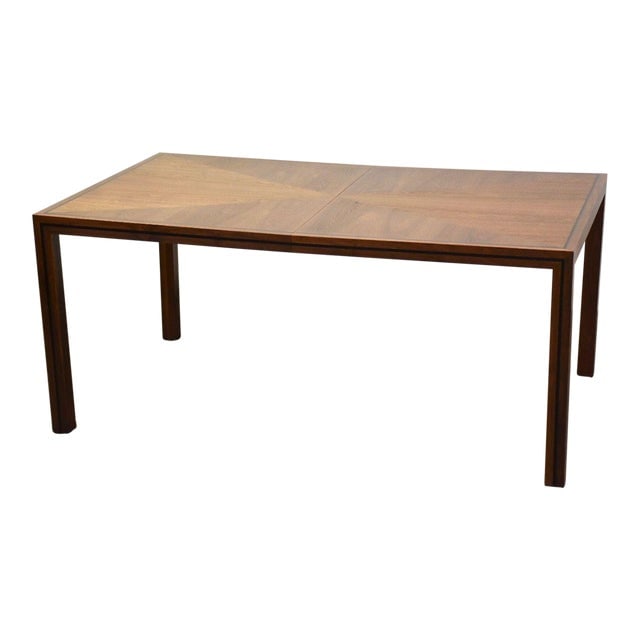 John Stuart Walnut Dining Table: John Stuart Walnut Dining Table A mid century modern walnut parsons style dining table with black stipe accents by John Stuart with two 19.875" leaves which fully extend it to 105.5". 65.75" wide. 41"