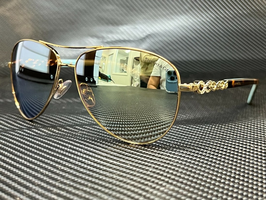 TIFFANY TF3049B 609164 Pale Gold Brown Mirror Womens Sunglasses 58 mm: TIFFANY TF3049B 609164 Pale Gold Brown Mirror Womens Sunglasses 58 mm Lens Technology: Gradient Mirrored Frame Color: Gold Uv Protection: 100% UV Type: Sunglasses Lens Material: Mirror Style: Aviator
