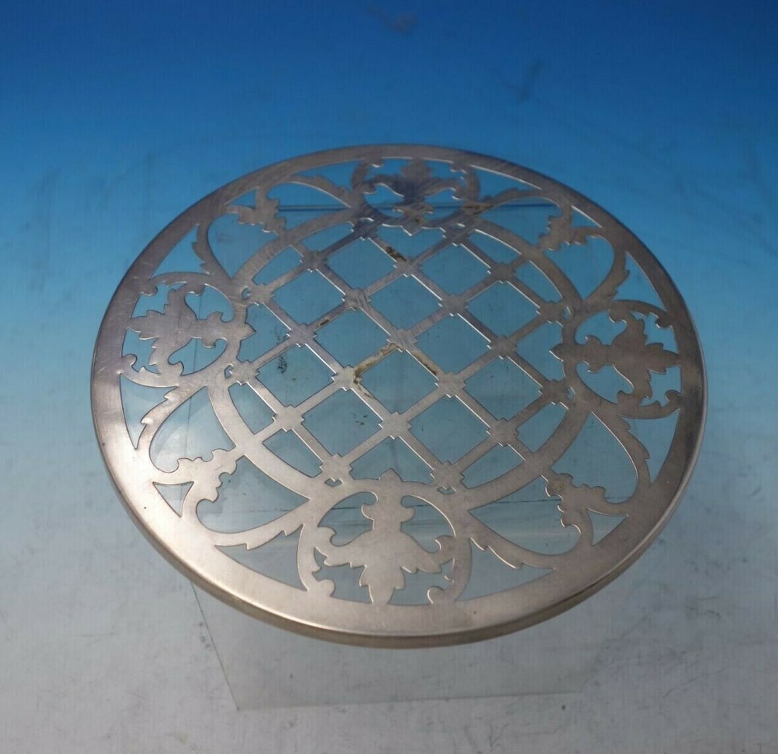 Deco Style by Unknown Trivet with Silver Overlay: Deco Style by Unknown Trivet with Silver Overlay Deco style by unknownbeautiful deco style trivet with silver overlay (maker unknown). This piece measures 7". It is not monogrammed and is in good vint