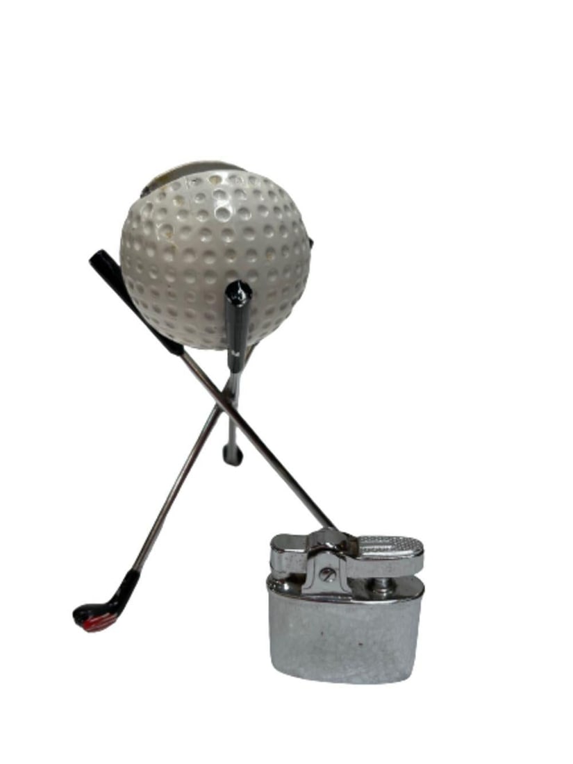 Mid Century Modern Novelty Pro Golf Ball Table Desk Lighter: Mid Century Modern Novelty Pro Golf Ball Table Desk Lighter Dimensions: Height: 4 in (10.16 cm)Width: 4 in (10.16 cm)Depth: 4 in (10.16 cm) Style: Mid-Century Modern (Of the Period) Materials and Tech