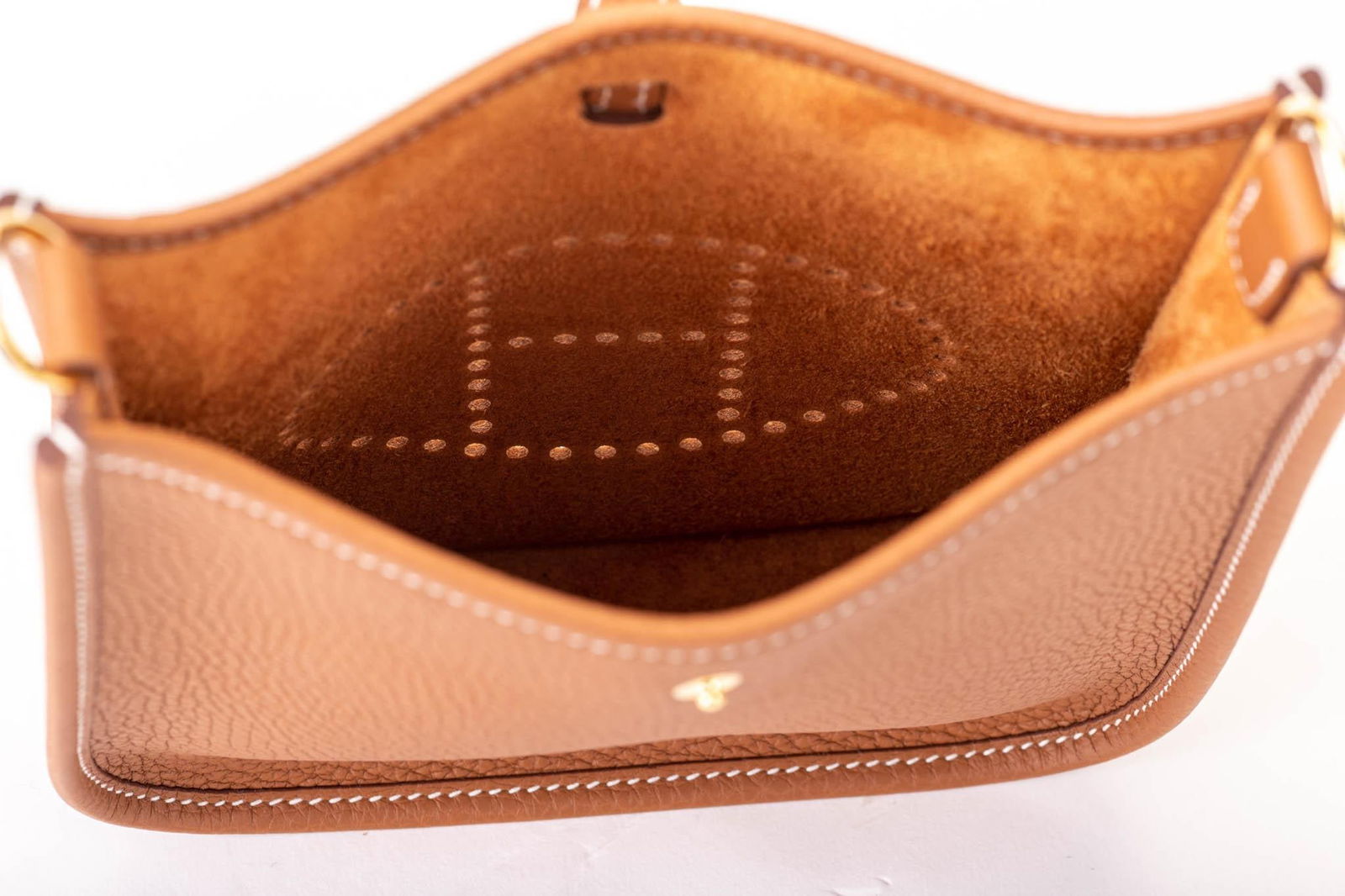 New in Box Hermes Mini Evelyne Gold Crossbody Bag with Gold Hardware: New in Box Hermes Mini Evelyne Gold Crossbody Bag with Gold Hardware Designer: Hermes Brand: Hermes Dimensions: Height: 8 in (20.32 cm)Width: 2 in (5.08 cm)Length: 6.5 in (16.51 cm) Place of Origin: F