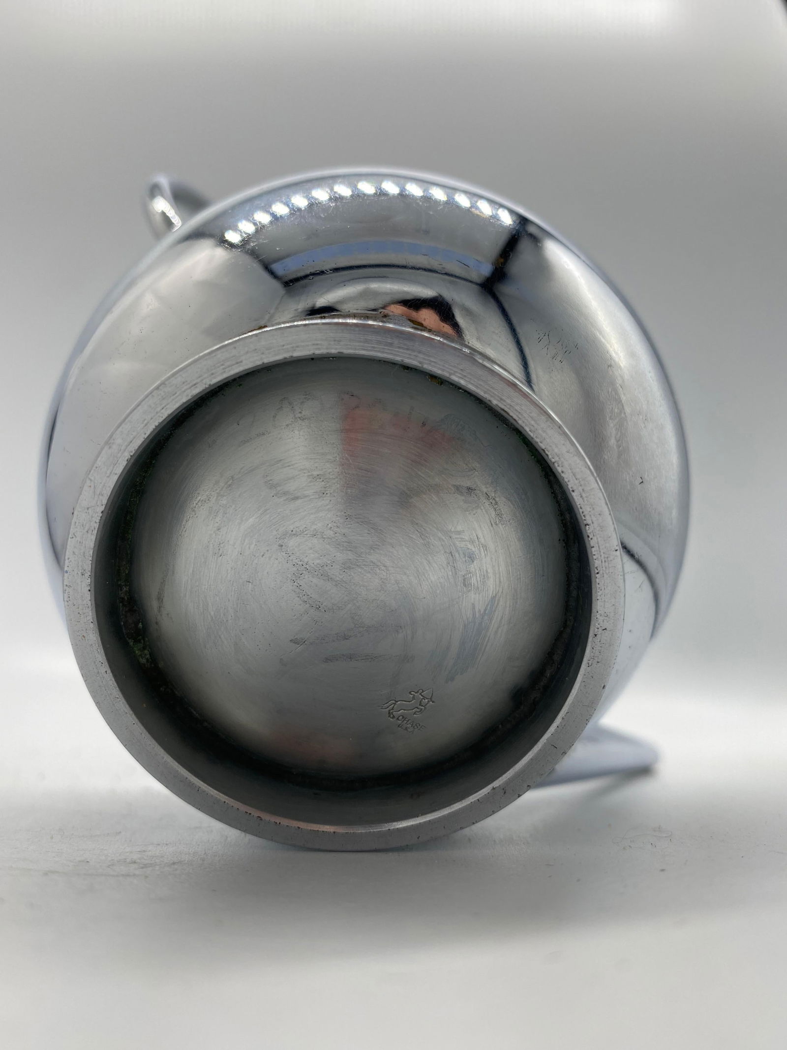 1934 Modernist Small Chrome Syrup Pitcher by Russel Wright for Chase Co.: 1934 Modernist Small Chrome Syrup Pitcher by Russel Wright for Chase Co. Creator: Chase Brass and Copper Company (Manufacturer) Dimensions: Height: 5.3 in (13.47 cm)Diameter: 2 in (5.08 cm) Materials