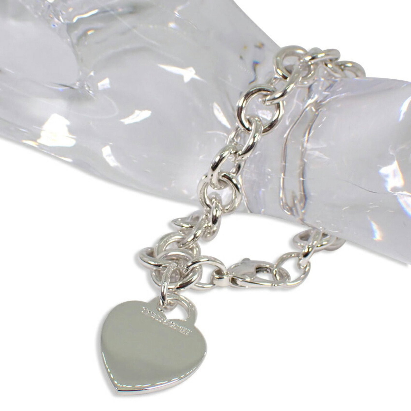 TIFFANY 925 Return to Tiffany Heart Tag Bracelet: TIFFANY 925 Return to Tiffany Heart Tag Bracelet Brand: Tiffany Line: Return To Tiffany Type: Charm bracelet Gender: Women Material: Sterling silver 925 Color: Silver Weight: 34.8g / 1.22oz. Stone Siz