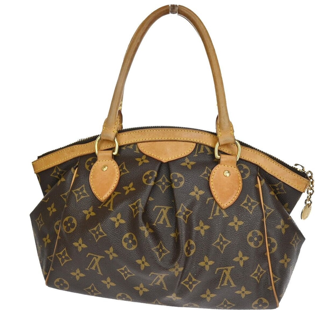 Louis Vuitton Tivoli: Louis Vuitton Tivoli Brand: Louis Vuitton Model: Tivoli Color: Brown Material: Canvas Dimensions: W 29 x H 21 x D 13 cm Country of Origin: France Comments: The Louis Vuitton Tivoli brown canvas handba