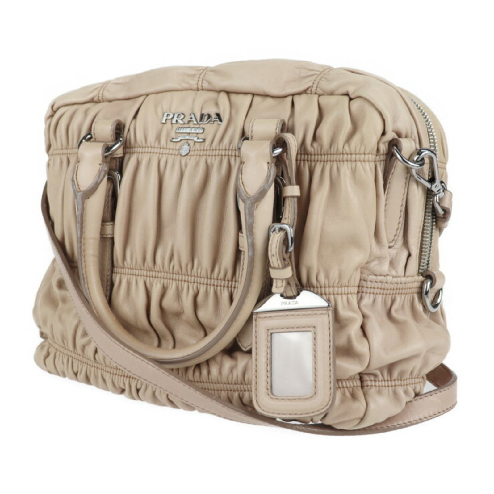 Prada Gaufre: Prada Gaufre Brand: Prada Model: Gaufre Color: Beige Material: Leather Dimensions: 20cm x 30cm x 11cm Country of Origin: Italy Comments: Outside : The corners and the handles are slightly rubbed. Insi