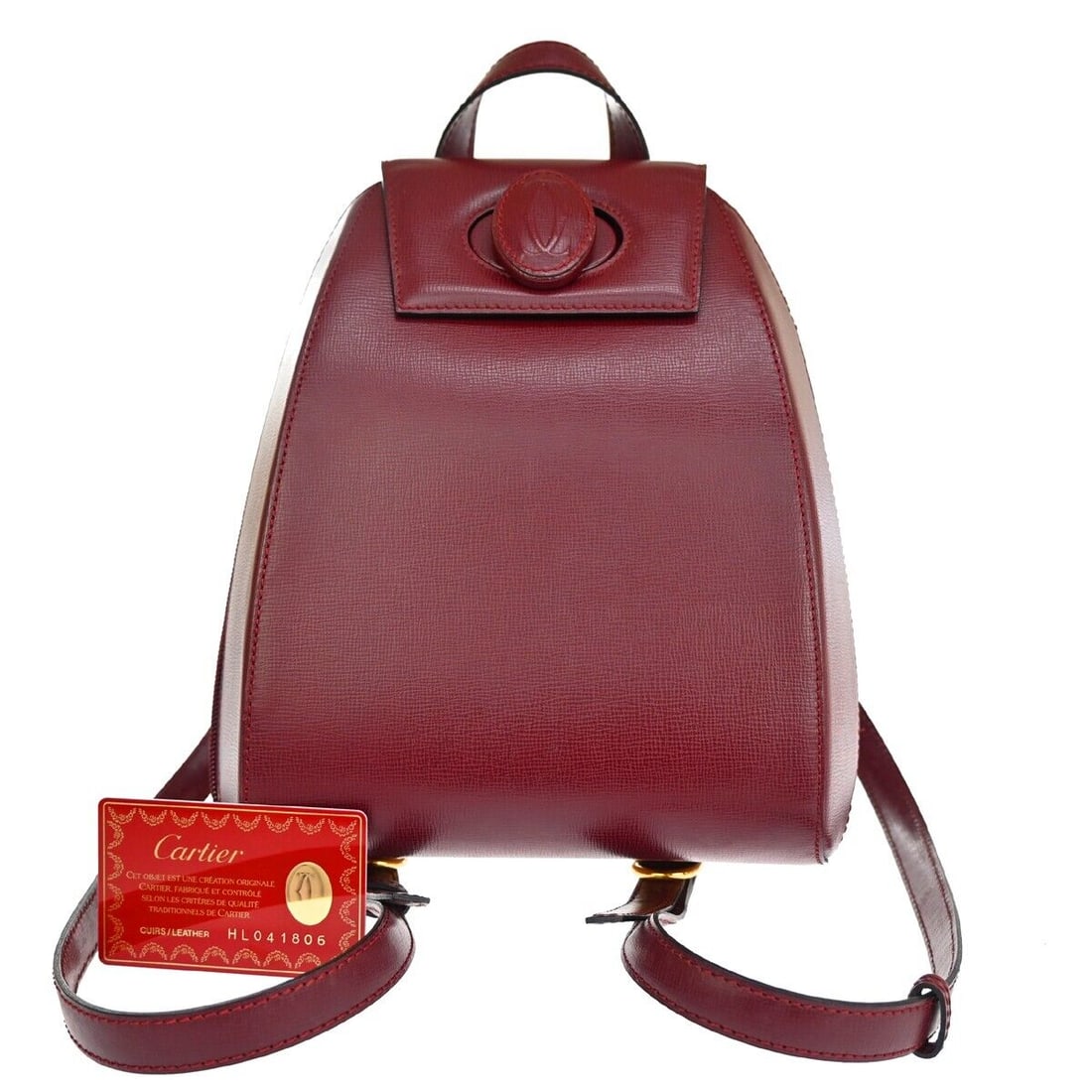 Cartier Must de Cartier: Cartier Must de Cartier Brand: Cartier Model: Must de Cartier Color: Burgundy Material: Leather Dimensions: W 21 x H 26 x D 10 cm : This women's Cartier backpack features a zipper closure and twist lo