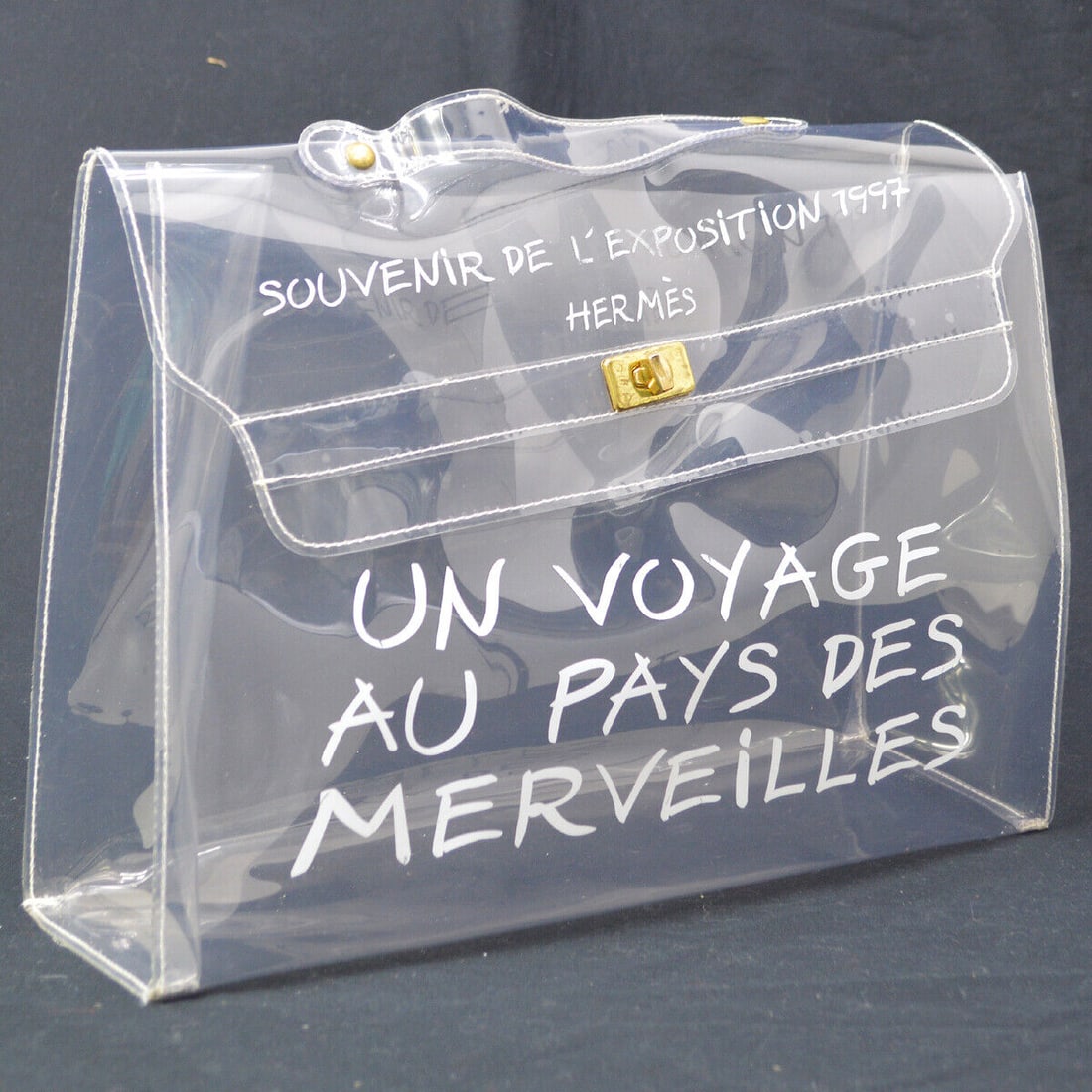 HERMES Vinyl Kelly Beach Hand Bag Purse SOUVENIR DE LEXPOSITION 1997: HERMES Vinyl Kelly Beach Hand Bag Purse SOUVENIR DE LEXPOSITION 1997 Bag Width: 15.7 Bag Height: 12.2 Closure: Flap Turnlock Occasion: Casual Size: Medium Handle Drop: 1.6 Lining Material: Vinyl Bag D