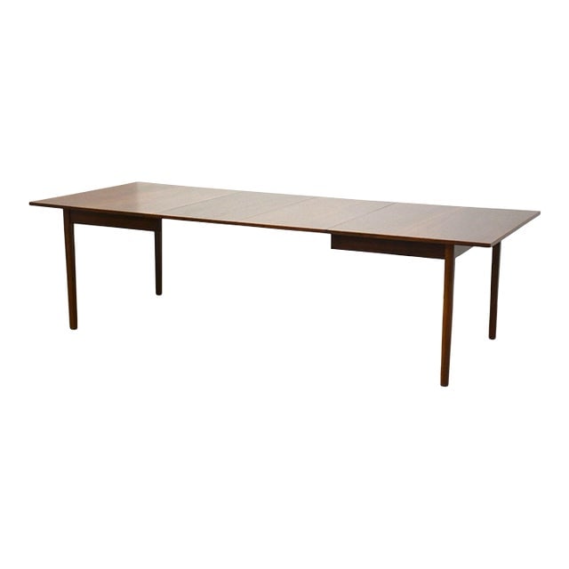 Refinished Walnut Dining Table: Refinished Walnut Dining Table A mid century modern walnut dining table with two 20" leaves which fully extend the table to 104". Professionally refinished. 64" wide. 42" deep. 29" tall. Dimensions: 6