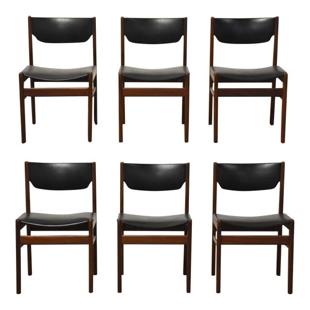 Danish Modern Teak Dining Chairs - Set of 6: Danish Modern Teak Dining Chairs - Set of 6 A set of six mid century modern teak dining chairs with black vinyl seats. Some minor slits in vinyl shown. Made in Denmark. Seat height is 17". 18" wide. 1