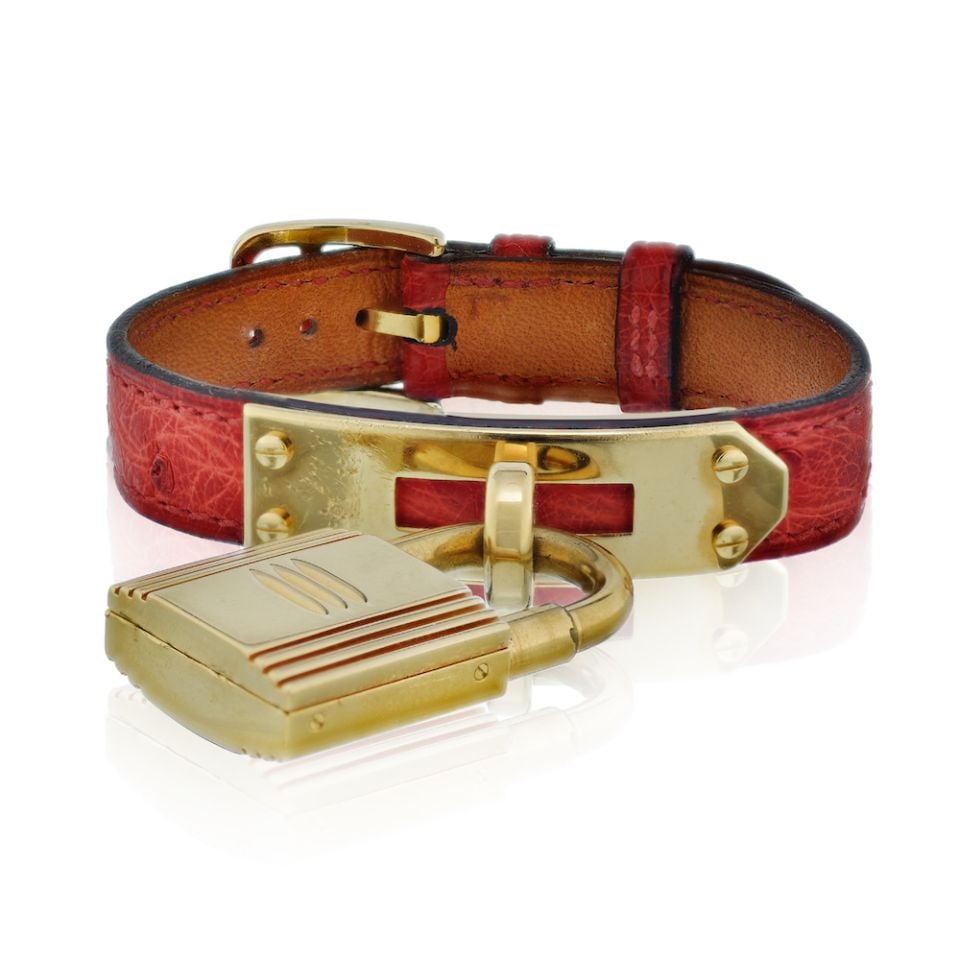 Hermes Kelly Stainless Steel Red Lizard Strap with Gold Tone Dial Watch: Hermes Kelly Stainless Steel Red Lizard Strap with Gold Tone Dial Watch Type: Vintage Watches Metal: Stainless Steel Grams: 36.6 Measurements: Up to 7.25 inches. Condition: Very Good. Signed By: Herme
