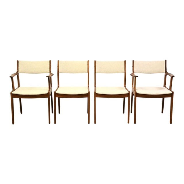 Danish Modern Teak Dining Chairs Set of 4 with Beige Upholstery: Danish Modern Teak Dining Chairs - Set of 4 A set of four mid century modern teak dining chairs with beige off white upholstery. Made in Denmark. Seat height is 18. Arms of arm chairs: 23.25" wide. 26