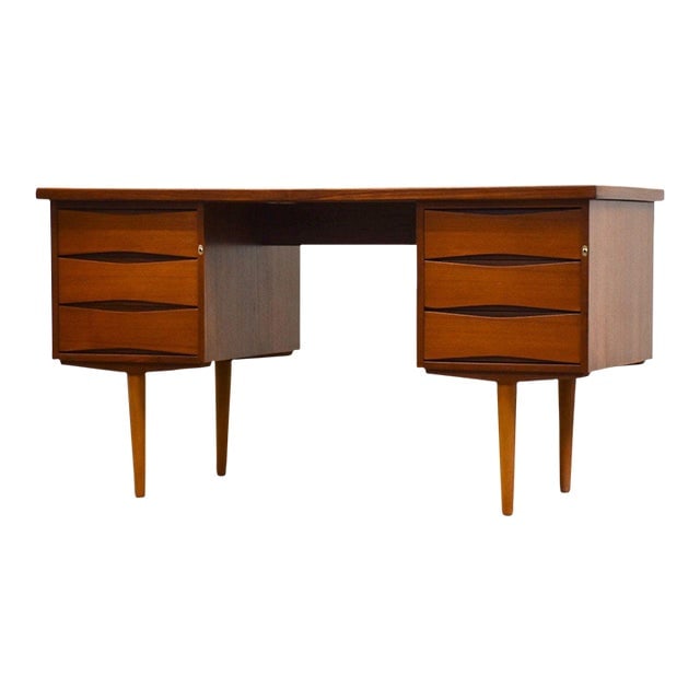 Norway Teak Modern Desk by Skeie 52.25in Wide Mid Century Rectangular: Norway Teak Modern Desk by Skeie A mid century modern teak desk made by Skeie Mobelfabrik. Made in Norway. Knee hole measures 20" wide by 27" tall. 52.25" wide. 24.375" deep. 28.25" tall. Dimensions: 