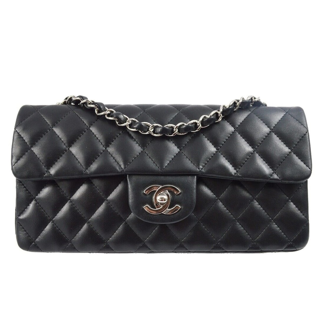 Chanel Black Lambskin East West Shoulder Bag: Chanel Black Lambskin East West Shoulder Bag Bag Width: 10 in Bag Height: 5 in Closure: Turn Lock Occasion: Casual Size: Medium Lining Material: Leather Bag Depth: 2 in Exterior Material: Lambskin Ext