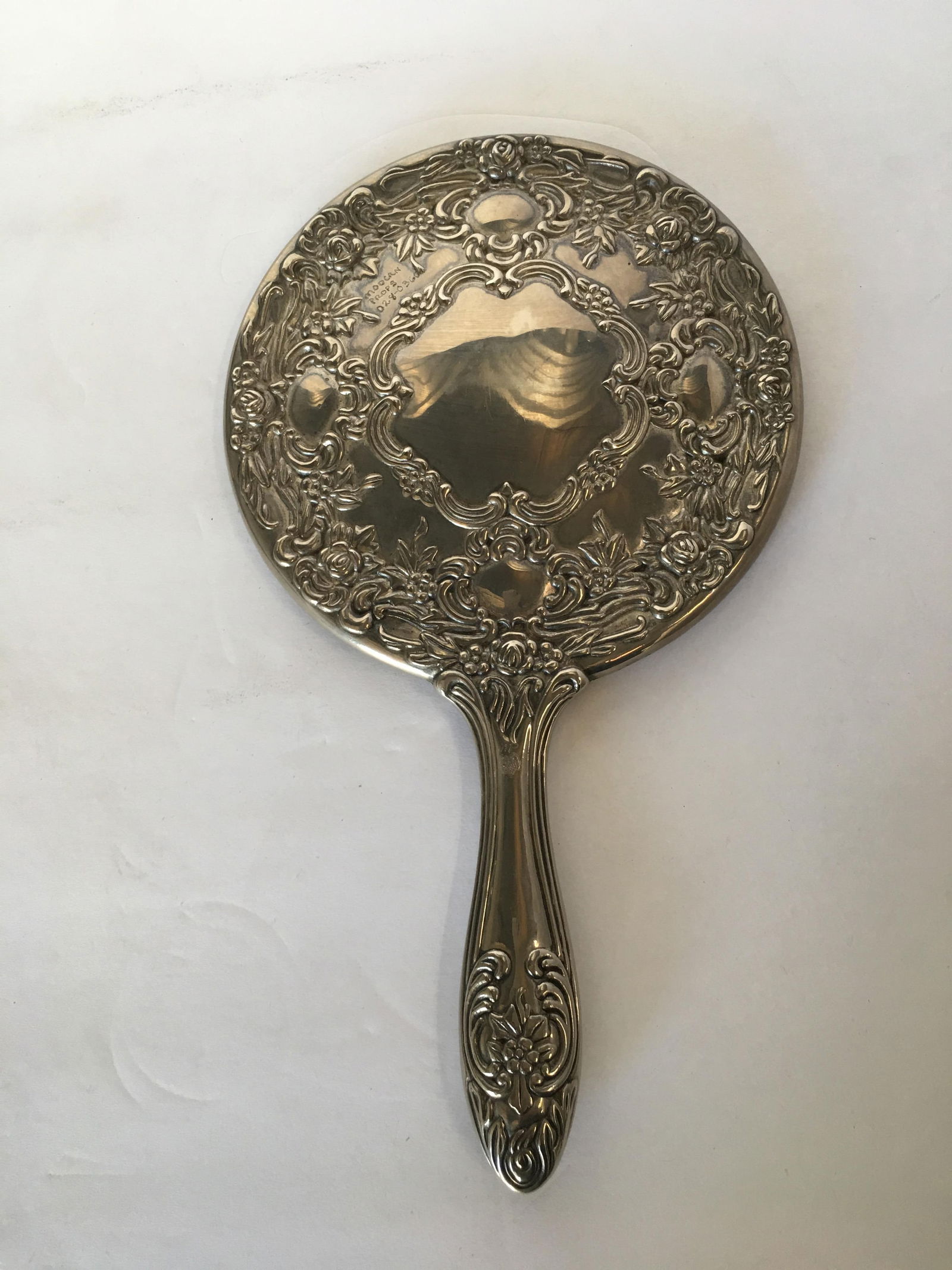 Antique Silver Plate Rose Pattern Vanity Hand Mirror 10in: Antique Silver Plate Rose Pattern Vanity Hand Dimensions: Height: 10 in (25.4 cm)Width: 6 in (15.24 cm)Depth: 0.5 in (1.27 cm) Materials and Techniques: Silver Place of Origin: United States Period: 1