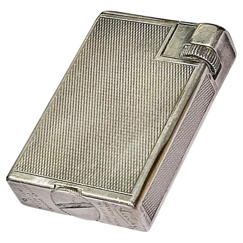 Art Deco Sterling Silver Arm Lighter by Dunhill: This exquisite Art Deco arm lighter by Alfred Dunhill Paris, crafted in 1938, showcases the elegance of the era. Made from sterling silver, this piece highlights the superb craftsmanship of Dunhill, a