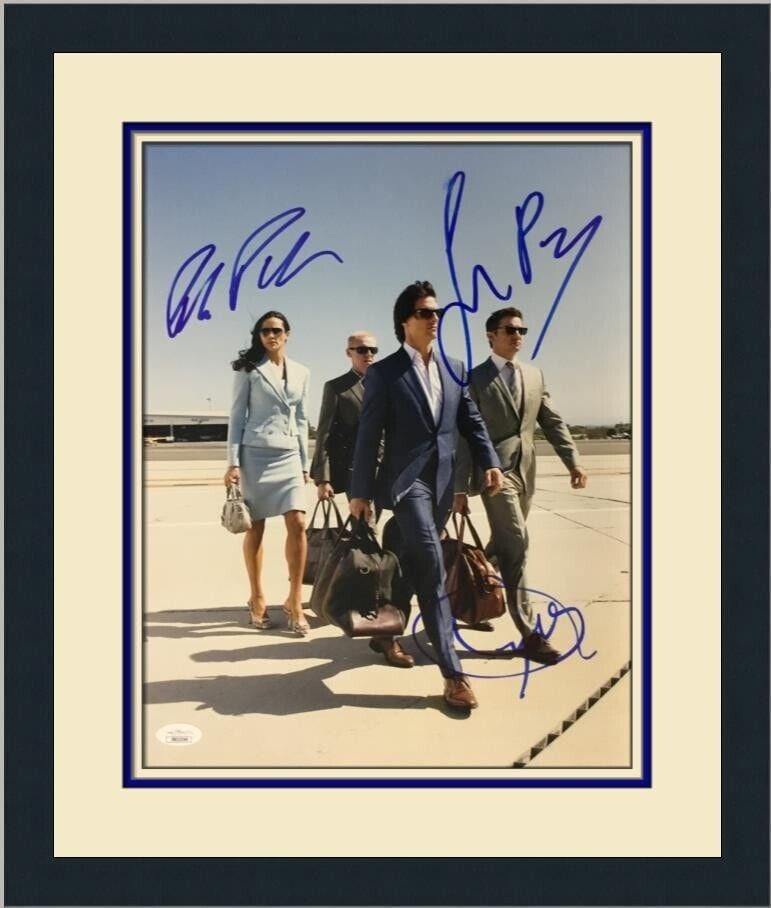 Mission Impossible Ghost Protocol Cast Signed Photo: This original, pre-owned signed photo from the movie 'Mission Impossible Ghost Protocol' features autographs by Jeremy Renner, Simon Pegg, and Paula Patton. Authenticated by James Spence (JSA), it is 