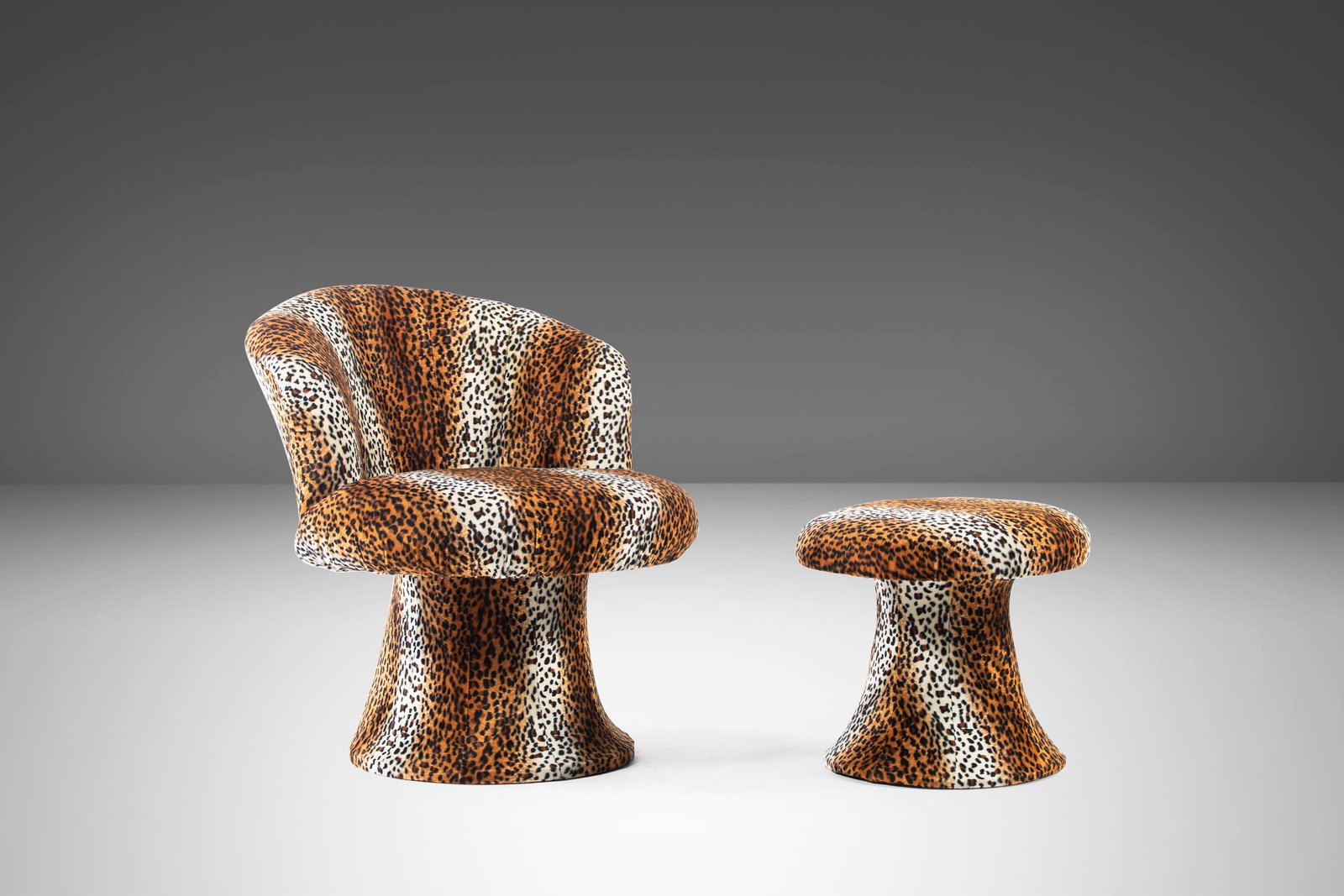 Leopard Print Tulip Chair & Ottoman Set, 1960s: Experience the unique charm of this Mid Century Modern Tulip Chair and Ottoman Set, inspired by Pierre Paulin's iconic Mushroom series. This set has been re-upholstered in striking leopard print fabri