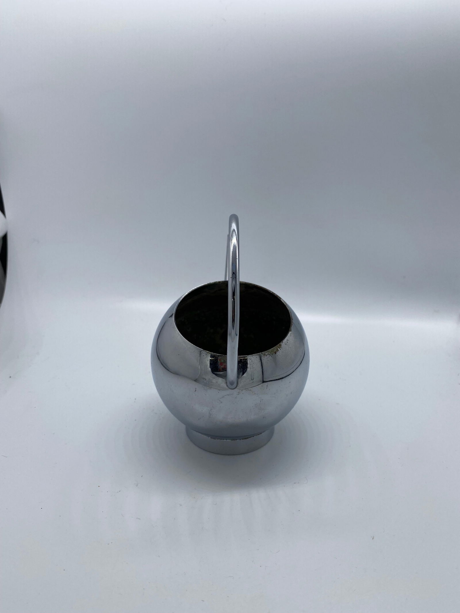 1934 Modernist Chrome Syrup Pitcher by Russel Wright for Chase Co: 1934 Modernist Chrome Syrup Pitcher by Russel Wright for Chase Co This 1934 Modernist syrup pitcher is crafted from chrome by Russel Wright for Chase Brass and Copper Company. With a height of 5.3 inc