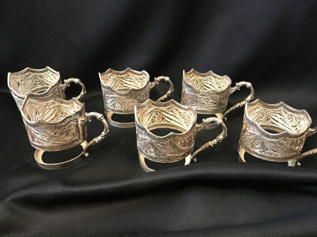 Set of 6 Silver Filigree Demitasse Cup Holders .800 Fine Sterling Silver: Set of 6 Silver Filigree Demitasse Cup Holders .800 Fine Sterling Silver This stunning set of 6 demitasse cup holders features exquisite silver filigree design, crafted from .800 fine sterling silver.