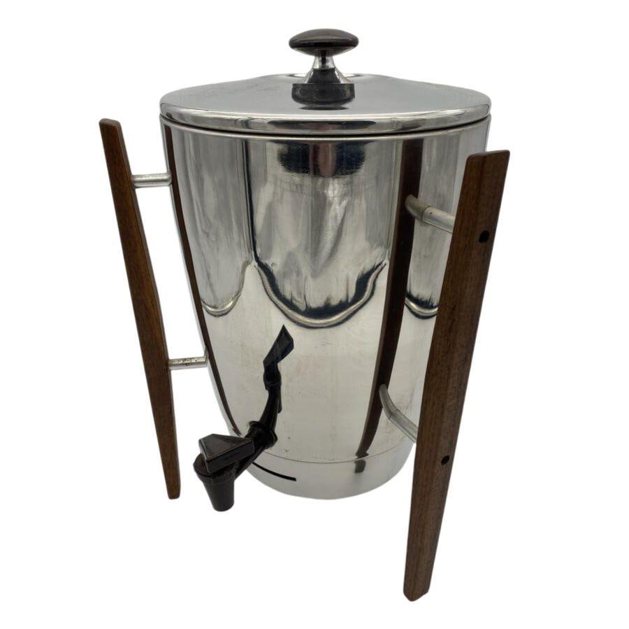 Mid Century Chrome Teak Coffee Maker by Regal 16.25in Height 11in Width 11in Depth: Mid Century Chrome Teak Coffee Maker by Regal 16.25in Height 11in Width 11in Depth This Mid Century Chrome and Teak Coffee Maker by Regal features a striking design and is a perfect addition to any vi