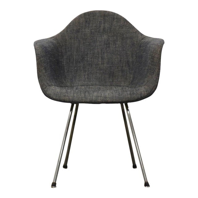 Eames Fiberglass Dax Dining Chair: Eames Fiberglass Dax Dining Chair A mid century modern dark grey fabric fiberglass DAX dining arm chair designed by Charles and Ray Eames. Seat height is 17.5". 25" wide. 24" deep. 31.5" tall. Dimensi
