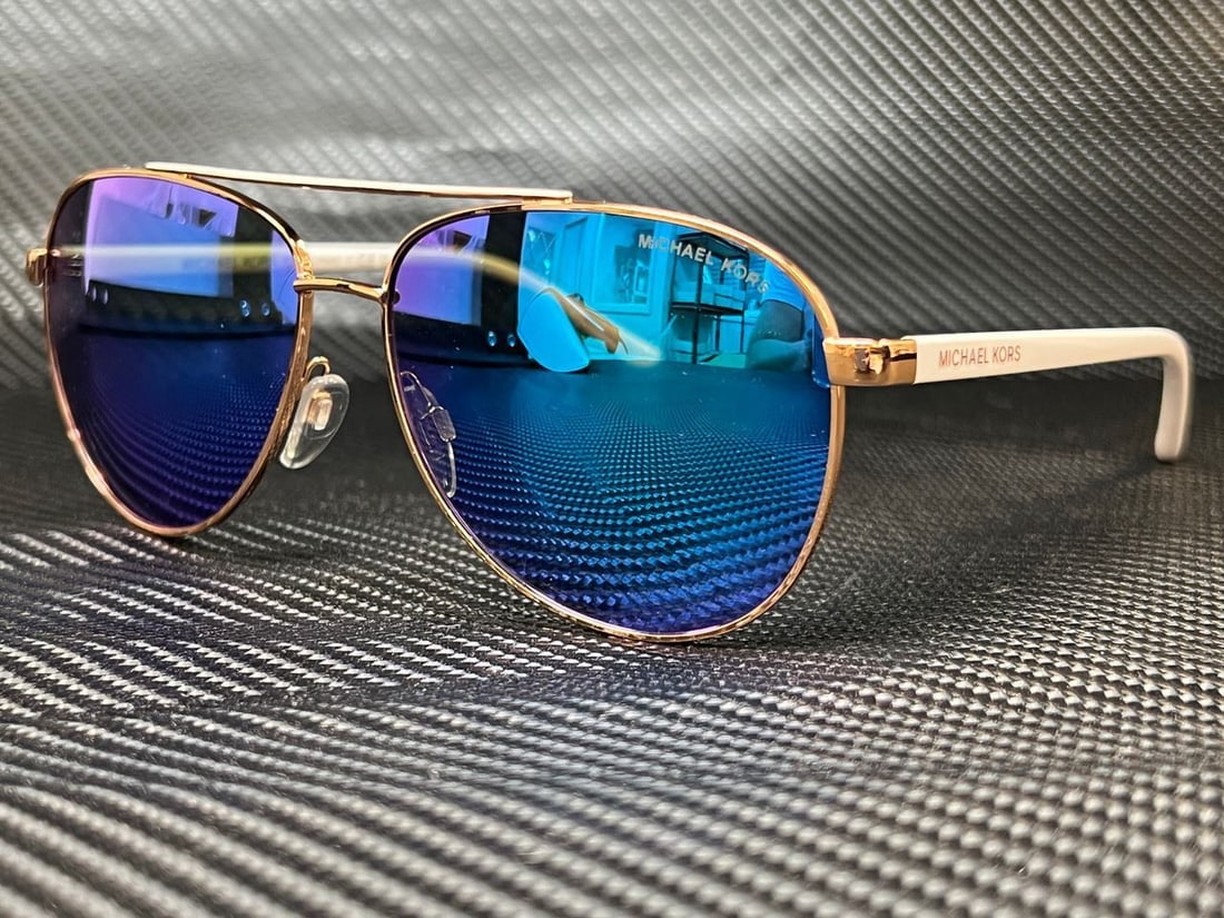 Michael Kors MK5007 104525 Rose Gold White Aviator Sunglasses: Michael Kors MK5007 104525 Rose Gold White Aviator Sunglasses Michael Kors MK5007 104525 sunglasses feature a stylish aviator design in rose gold and white. They are equipped with mirrored lenses made