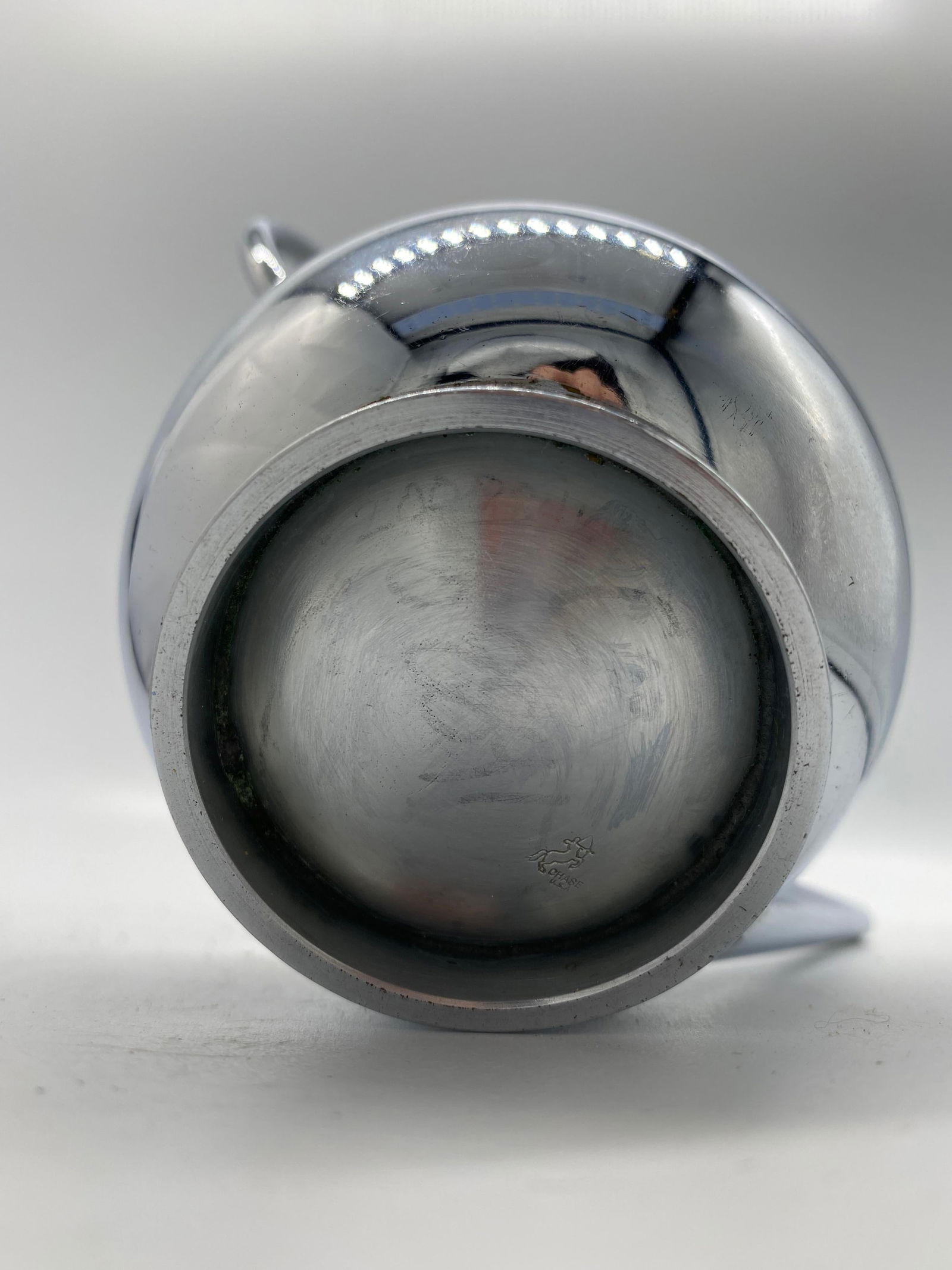 1934 Modernist Chrome Syrup Pitcher by Russel Wright for Chase Co: 1934 Modernist Chrome Syrup Pitcher by Russel Wright for Chase Co This 1934 Modernist syrup pitcher is crafted from chrome by Russel Wright for Chase Brass and Copper Company. With a height of 5.3 inc