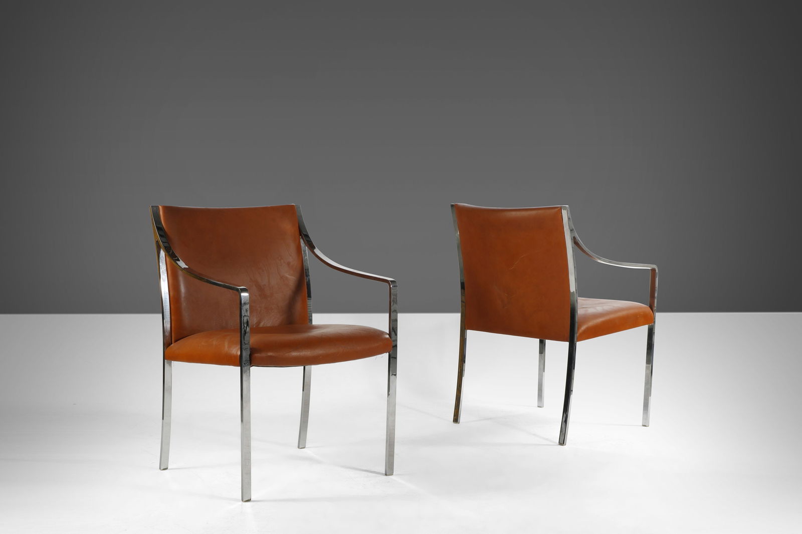 Set of Two Chrome Accent Chairs by Bert England for Stow Davis 1960s Naugahyde: Set of Two Chrome Accent Chairs by Bert England for Stow Davis 1960s Naugahyde This set of two chrome accent chairs designed by Bert England for Stow Davis in the 1960s features an architectural chrom