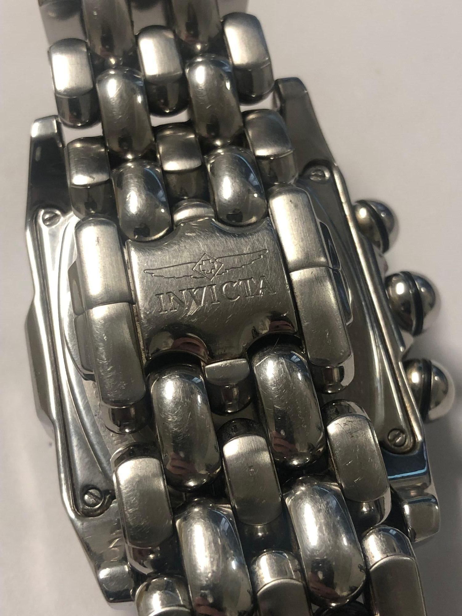 Invicta Men's Copper Face Watch Lupah Model 2221 Steel 2000: Invicta Men's Copper Face Watch Lupah Model 2221 Steel 2000 This Invicta Men's Lupah Watch Model 2221 features a striking copper face and is crafted from durable steel. With dimensions of 1.97 inches