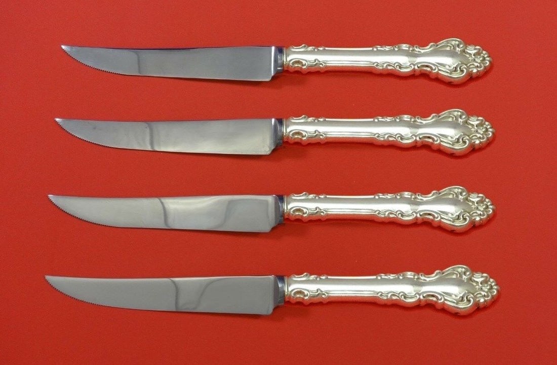 Spanish Baroque Sterling Silver Steak Knife Set 4pc by Reed and Barton: Spanish Baroque Sterling Silver Steak Knife Set 4pc by Reed and Barton This exquisite 4-piece steak knife set features a Spanish Baroque design by Reed and Barton, crafted from sterling silver with ho