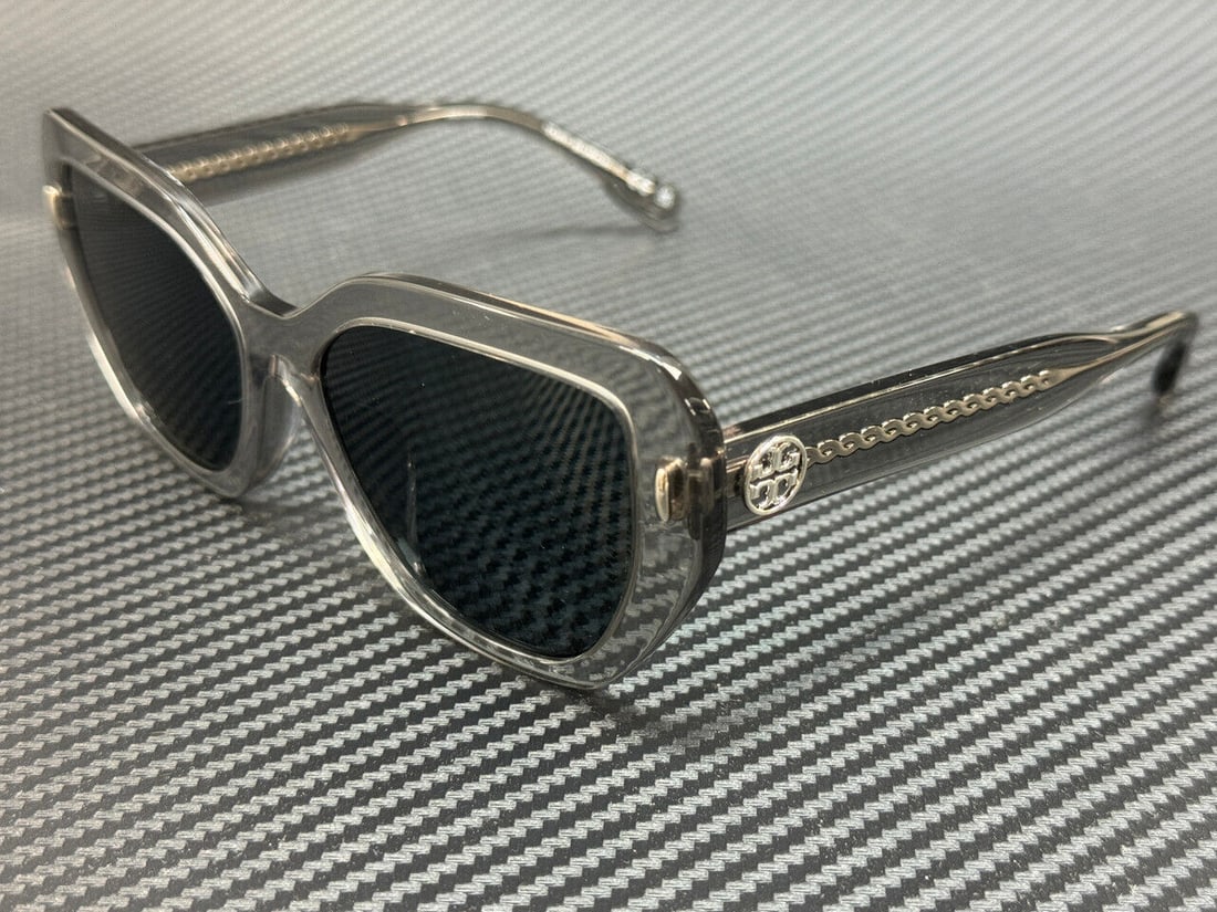Tory Burch Dark Grey Oversized Sunglasses 55mm: Tory Burch Dark Grey Oversized Sunglasses 55mm Stylish Tory Burch oversized sunglasses featuring a gray frame and dark lenses. Perfect for adding a chic touch to any outfit. Specifications Frame Color