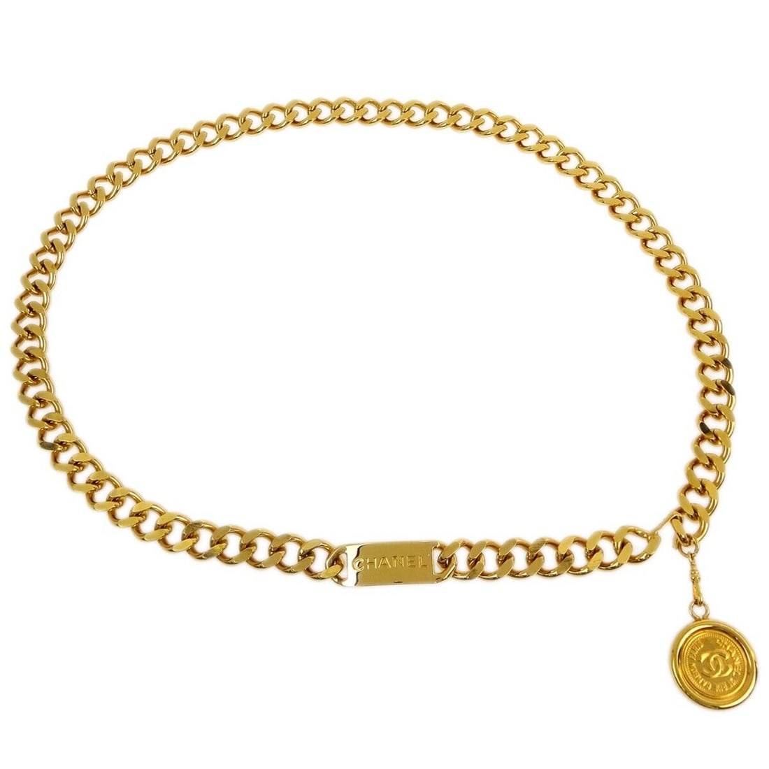 Chanel Gold-Plated Chain Belt with Medallion Charm: Chanel Gold-Plated Chain Belt with Medallion Charm Type: Belt. Size: One Size. Color: Gold. Style: Chain Belt. Material: Gold-plated. This gold-plated chain belt features a medallion charm making it a