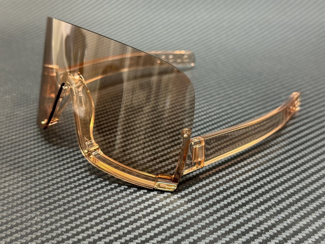 GUCCI GG1631S 010 Pink Transparent Medium Sunglasses 65 mm for Women: GUCCI GG1631S 010 Pink Transparent Medium Sunglasses 65 mm for Women These GUCCI GG1631S 010 sunglasses feature a stylish pink transparent frame, designed for women. With a medium size and a lens widt