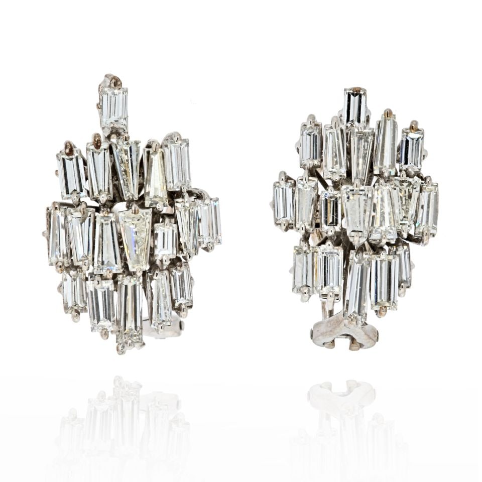 Vintage 1960's Platinum Baguette Diamond Earrings 7 Cts 0.6in: Vintage 1960's Platinum Baguette Diamond Earrings 7 Cts 0.6in These exquisite vintage earrings are crafted from platinum and feature a stunning arrangement of baguette cut diamonds totaling 7 carats. 