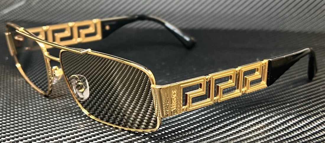Versace VE2257 Gold Mirror Sunglasses 60mm for Men: Versace VE2257 Gold Mirror Sunglasses 60mm for Men These Versace sunglasses feature a striking gold frame color and a rectangular shape, designed for men. The mirrored lenses add a stylish touch, maki