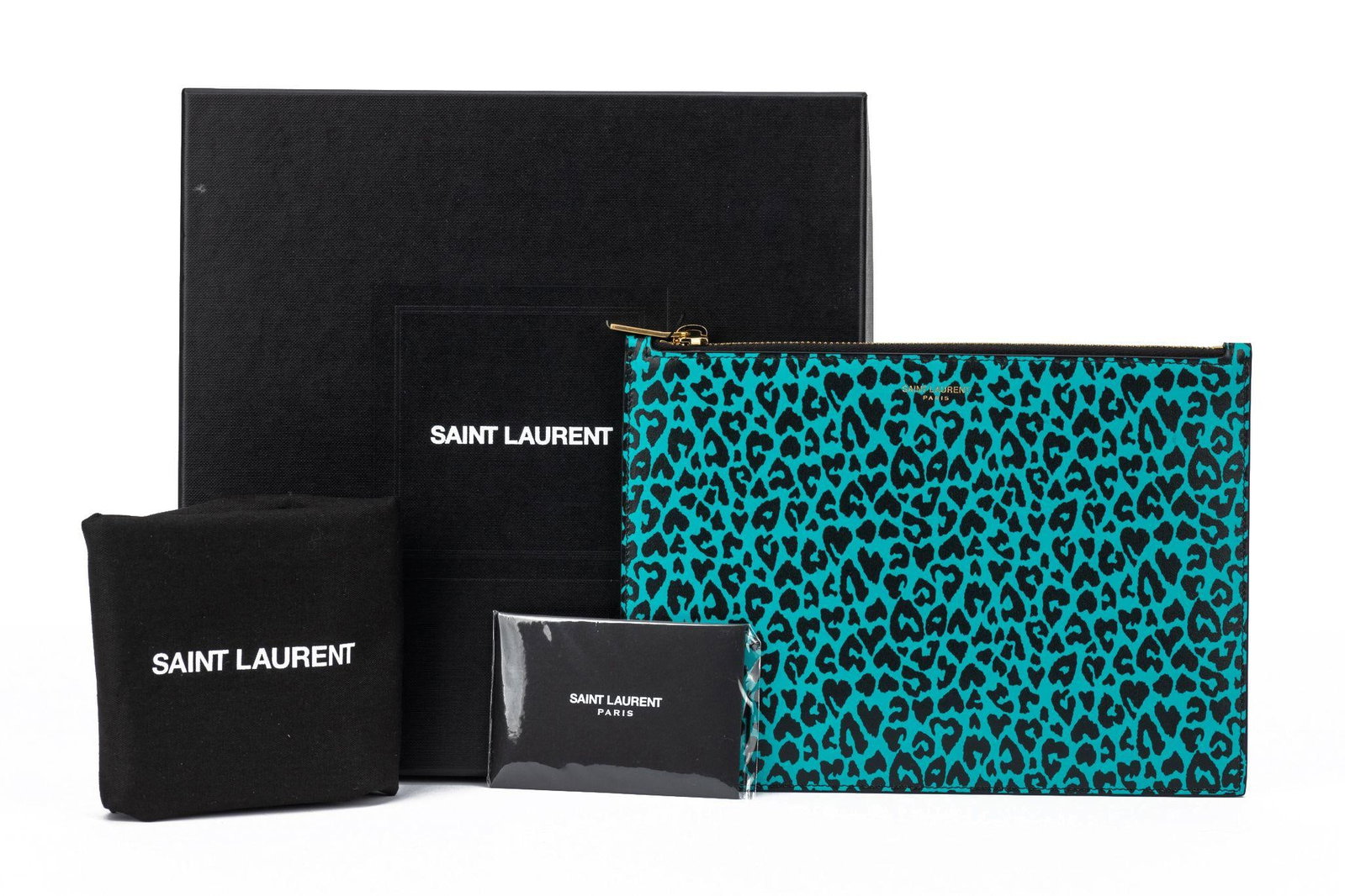 Yves Saint Laurent Cheetah Print Turquoise Leather Pouch 6.75in x 9.25in: Yves Saint Laurent Cheetah Print Turquoise Leather Pouch 6.75in x 9.25in This Yves Saint Laurent pouch features a striking cheetah print on a turquoise leather background. With dimensions of 6.75 in h