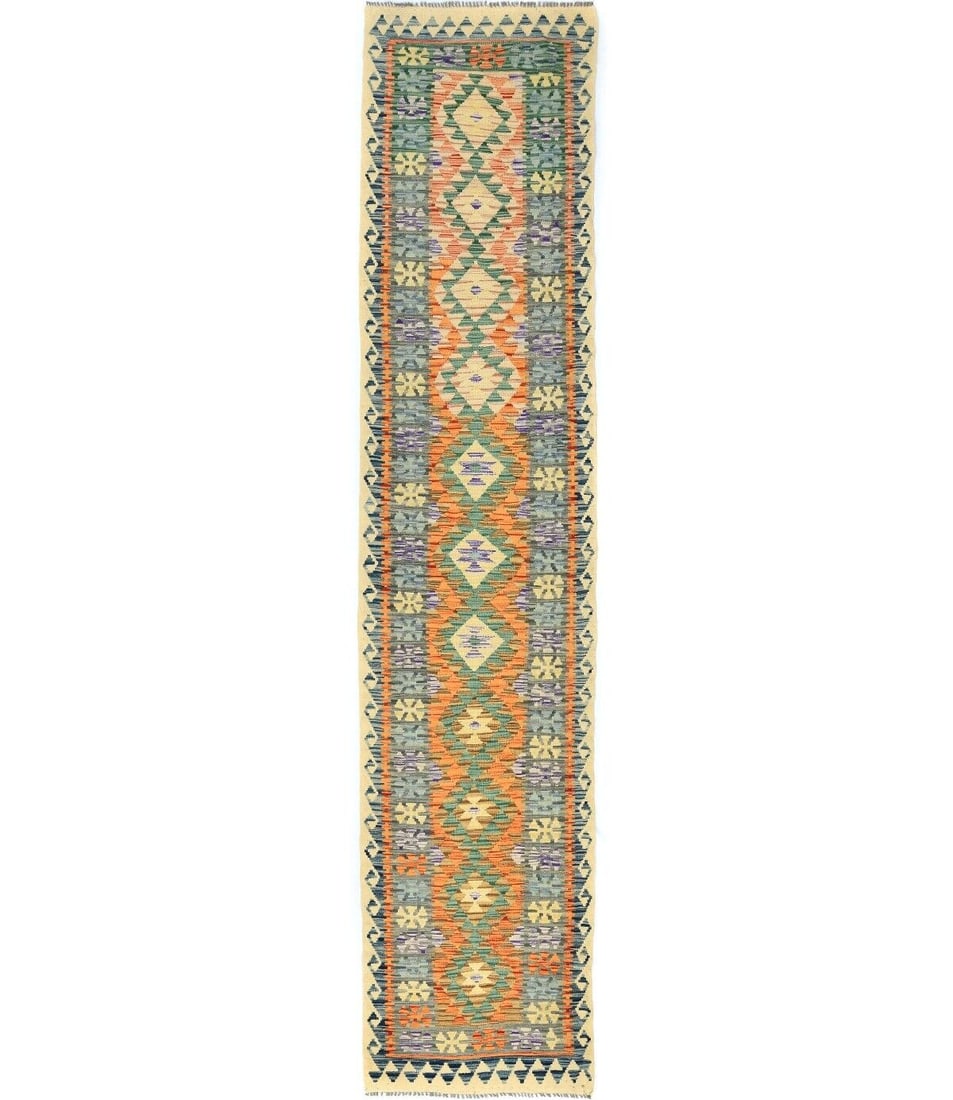 Reversible Geometric Tribal Runner Rug 3ft x 13ft Multicolored Wool: Reversible Geometric Tribal Runner Rug 3ft x 13ft Multicolored Wool This reversible geometric tribal runner rug is perfect for hallways, measuring 3 feet by 13 feet. Hand-woven from wool, it features