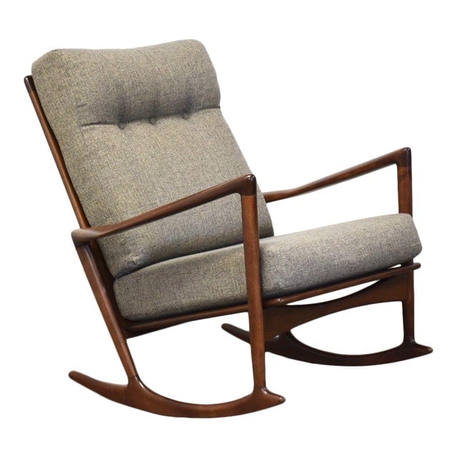 Ib Kofod Larsen Mid Century Modern Rocking Chair in Gray Upholstery: Ib Kofod Larsen Mid Century Modern Rocking Chair in Gray Upholstery This mid century modern rocking chair designed by Ib Kofod Larsen for Selig features a walnut-colored frame with elegant grey uphols