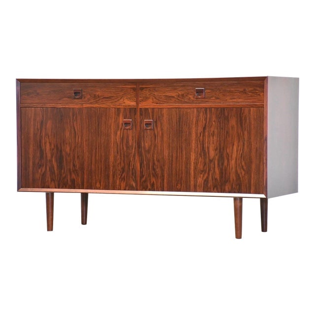 Danish Modern Rosewood Sideboard Credenza by Brouer Mobelfabrik: Danish Modern Rosewood Sideboard Credenza by Brouer Mobelfabrik A mid century modern rosewood credenza featuring two drawers and two doors that conceal adjustable shelves. This piece, crafted by Broue