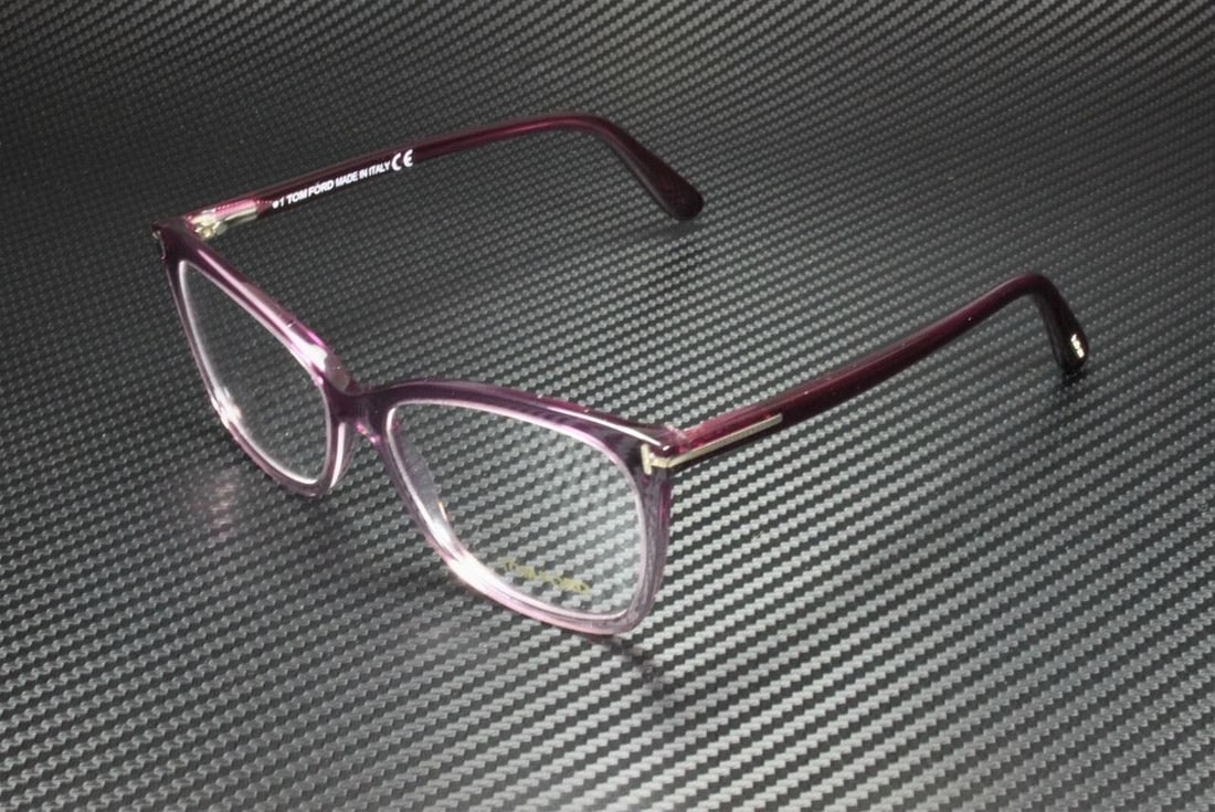 TOM FORD FT5514 083 Cat Eye Eyeglasses in Violet Transparent 54mm: TOM FORD FT5514 083 Cat Eye Eyeglasses in Violet Transparent 54mm Elevate your eyewear collection with the TOM FORD FT5514 083 eyeglasses. These stylish cat eye frames feature a vibrant purple color,